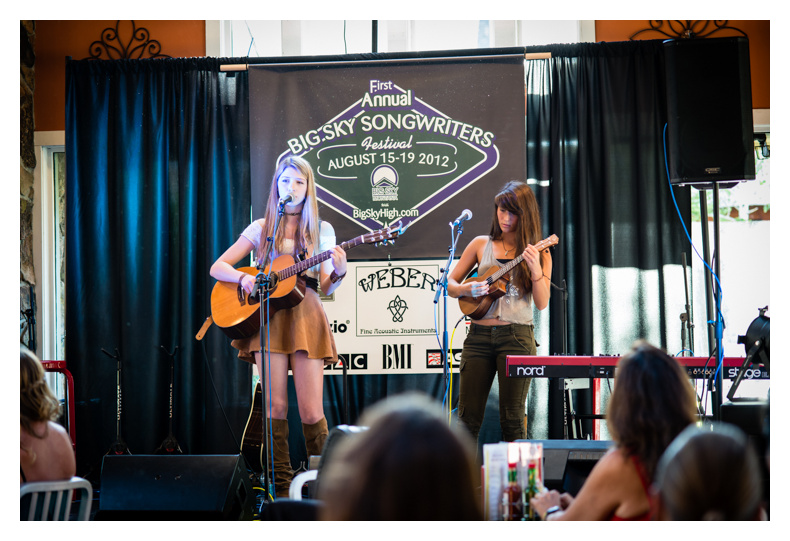 Attendees perform at the songwriter showcase.